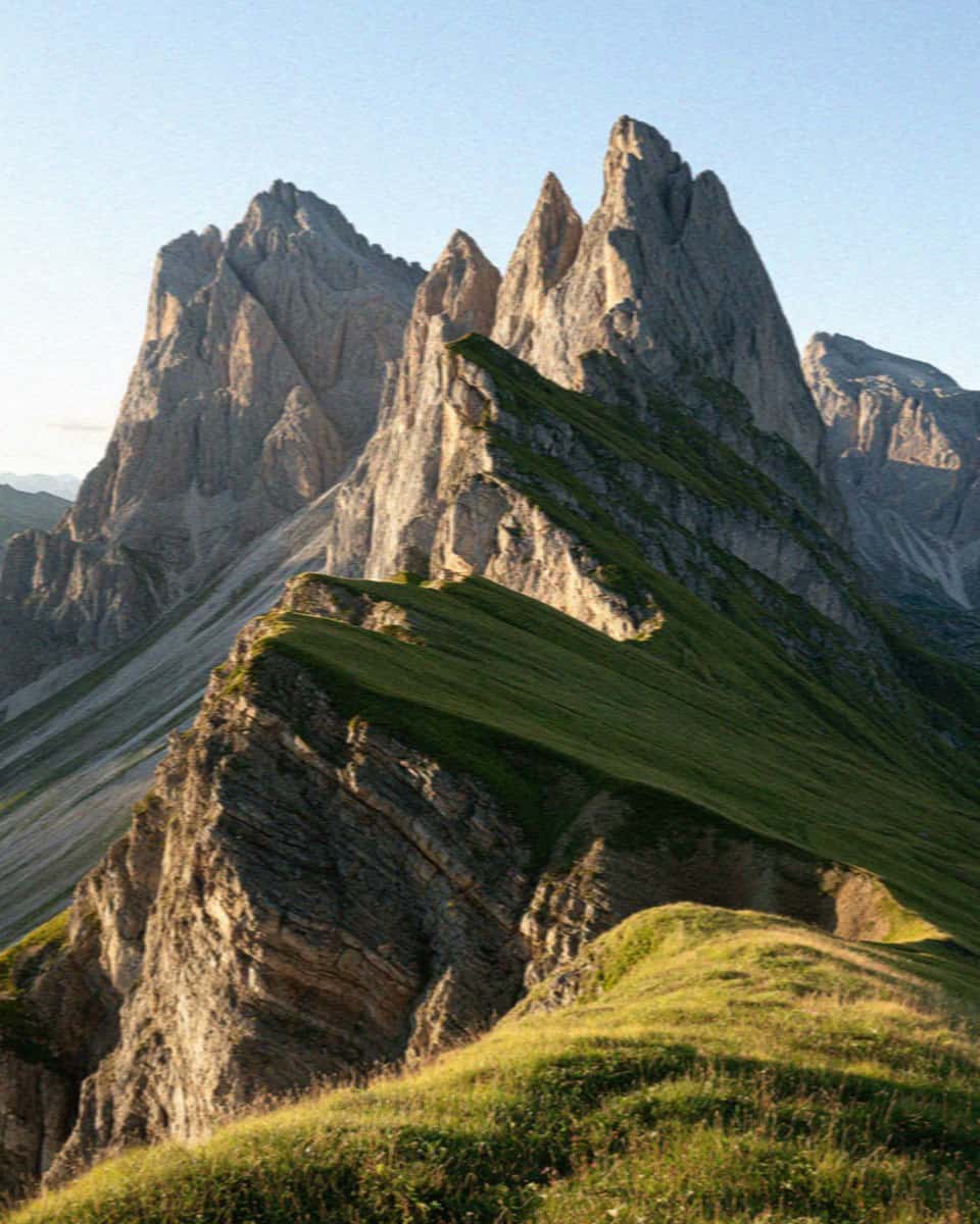 The grassy Seceda ridgeline and jagged towers in the Dolomites