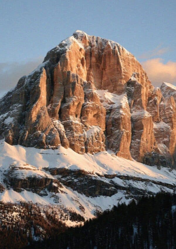The Tofana peak catching warm alpenglow in the Dolomites