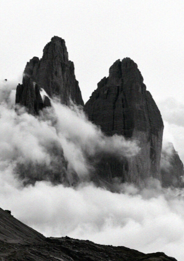 The Tre Cime half wrapped in cloud in the Dolomites
