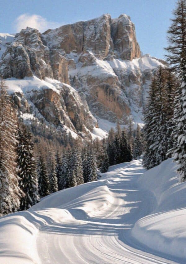 Snow-covered ski pistes below the Sella massif in the Dolomites