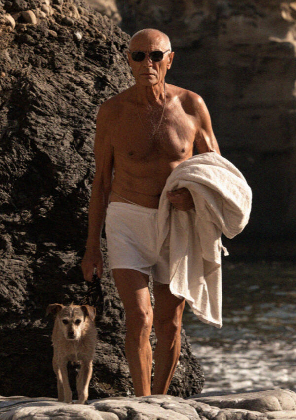 A local man arriving at the thermal cove at Sorgeto on Ischia with his dog