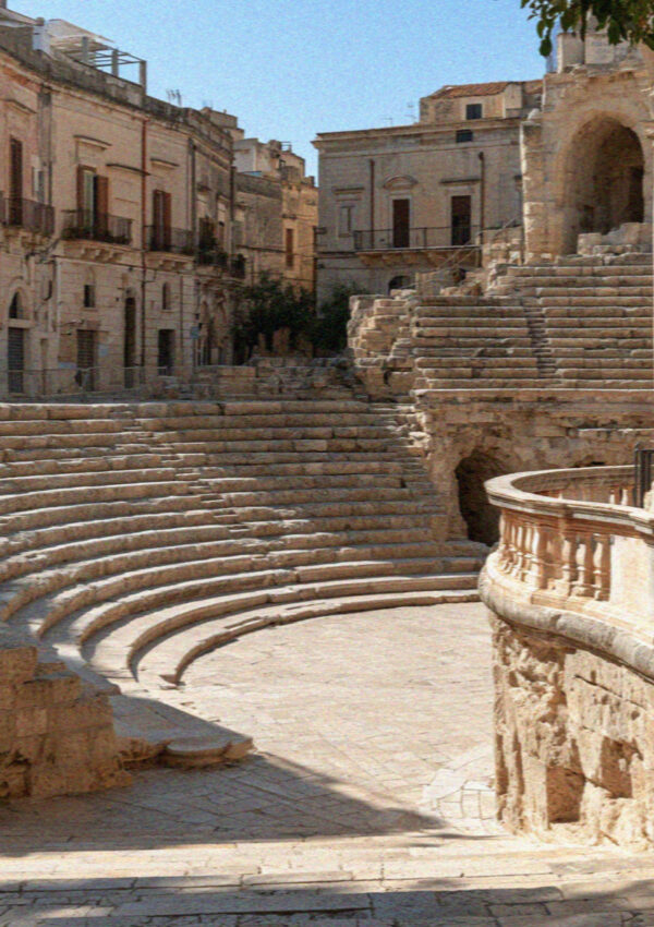 The Roman amphitheatre in Lecce seen from the railing at street level