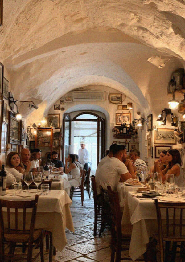 The interior of a small family run trattoria in Lecce in the evening