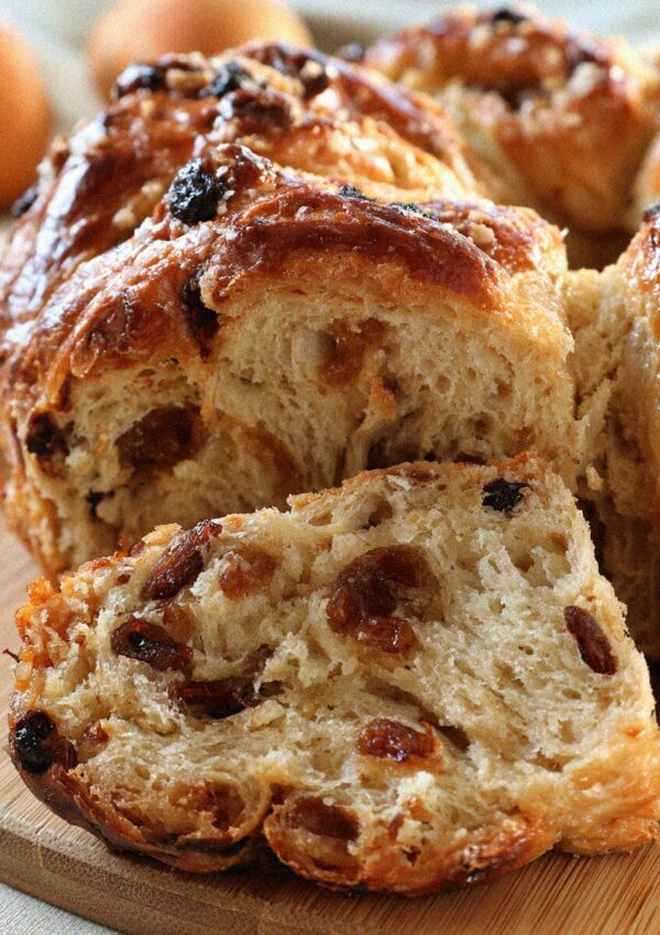 Sliced buccellato, Lucca's ring of sweet aniseed and raisin bread, on a board