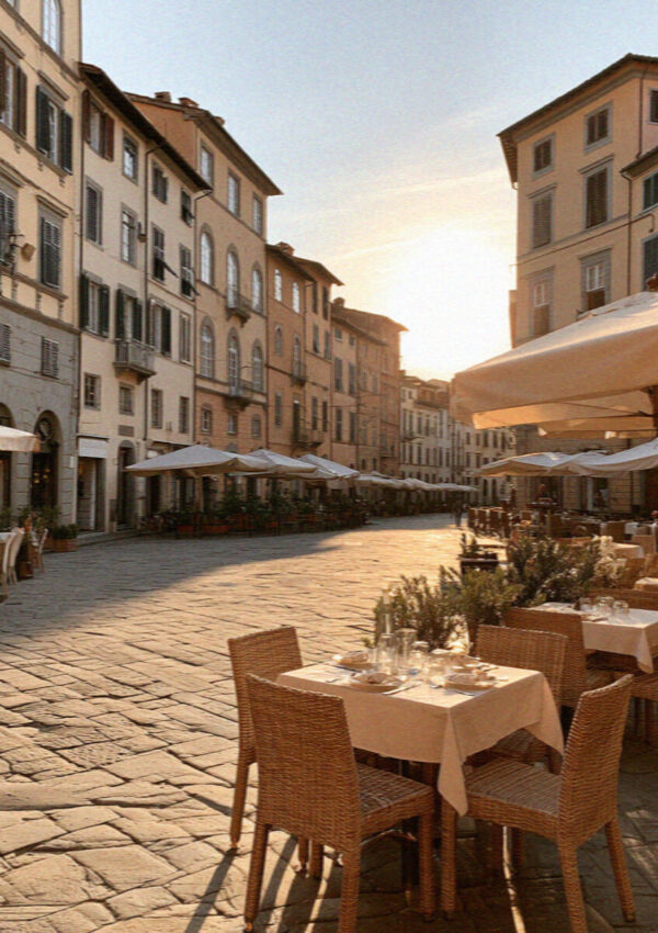 The oval Piazza dell'Anfiteatro in Lucca ringed by pastel houses