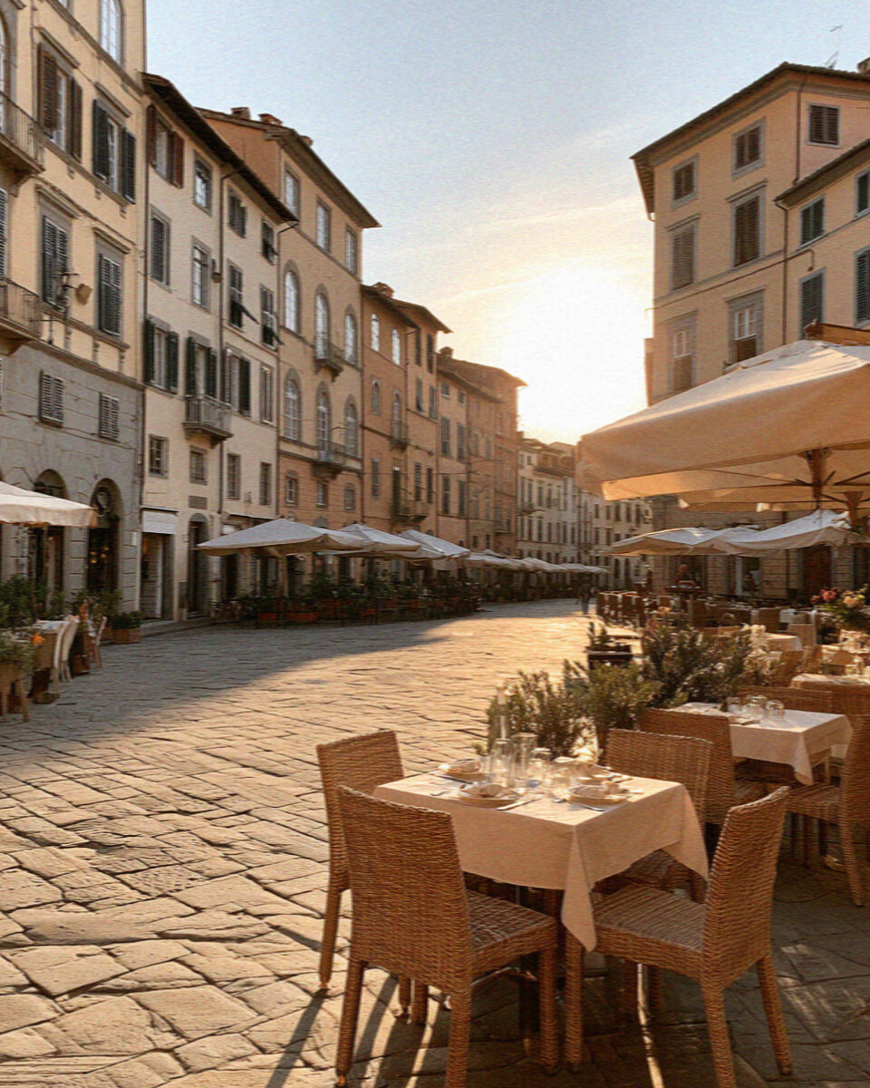The oval Piazza dell'Anfiteatro in Lucca ringed by pastel houses