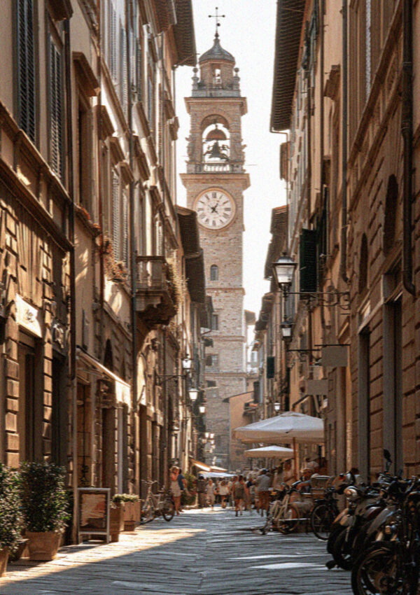 Via Fillungo, the medieval main street of Lucca, with old shopfronts and a tower