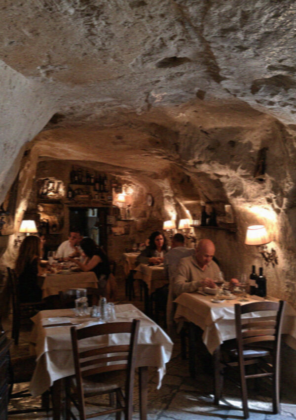A small cave trattoria in Matera in the evening