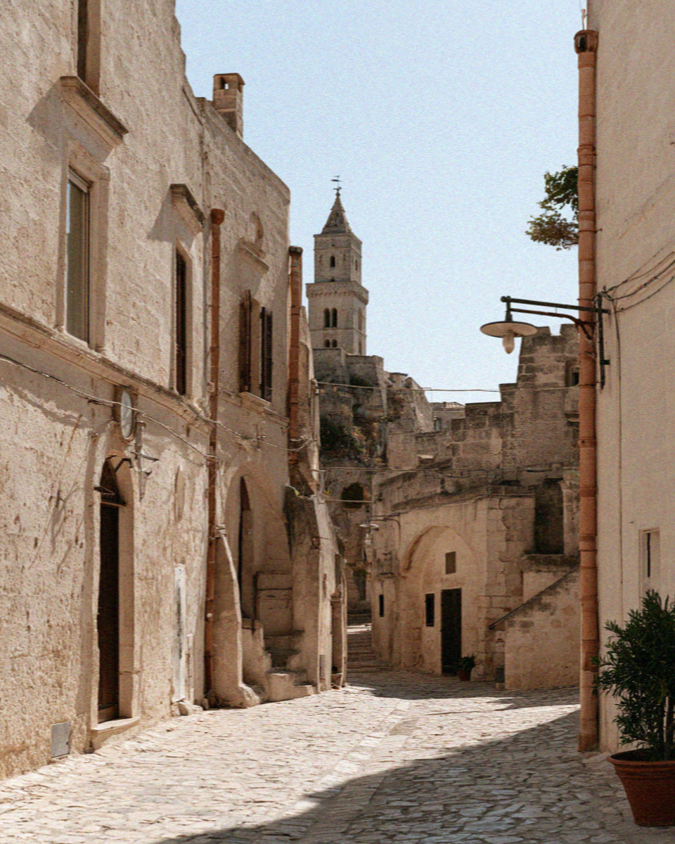Matera at midday in high summer, bleached stone and no shade