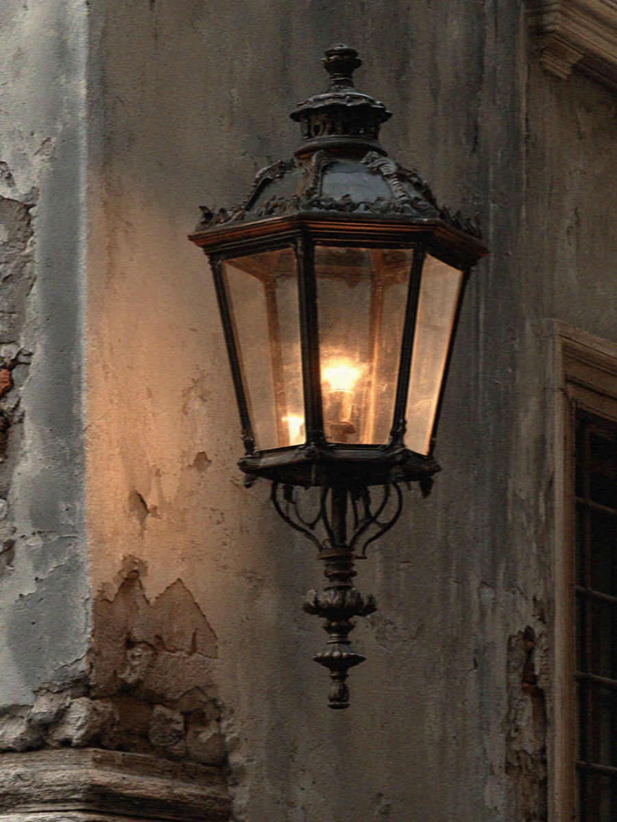An old iron lamp on a Milan wall at dusk