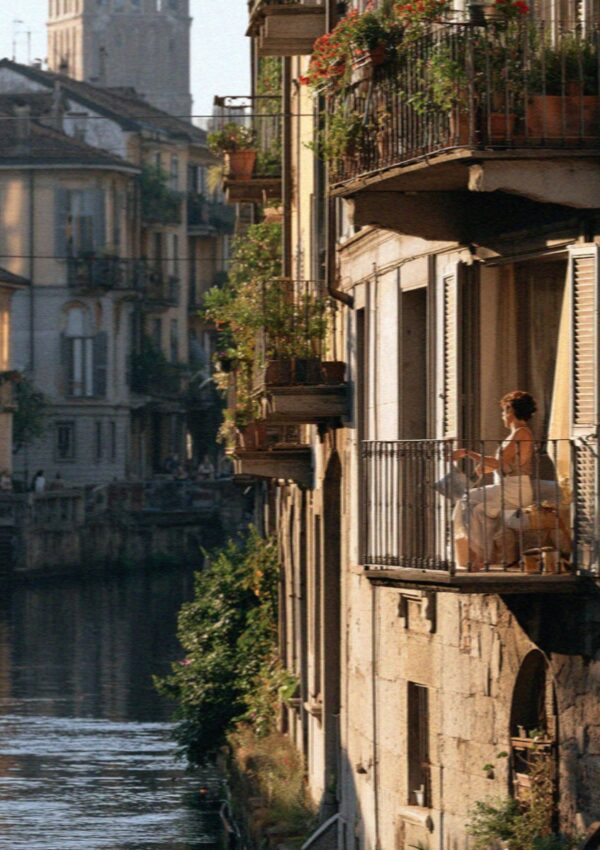 A Milan canal running between old buildings in the evening