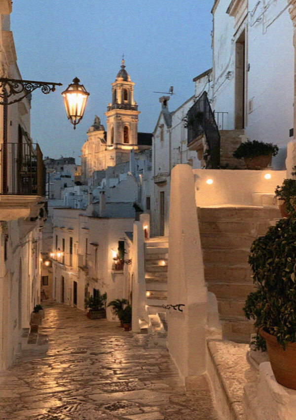 A lamplit lane in the old town of Ostuni in Puglia late at night
