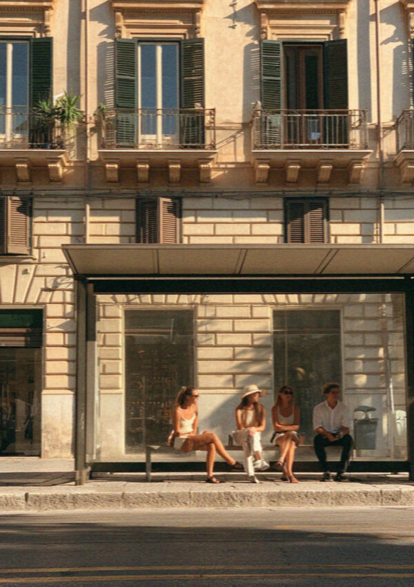 People waiting at a bus stop in Palermo, Sicily