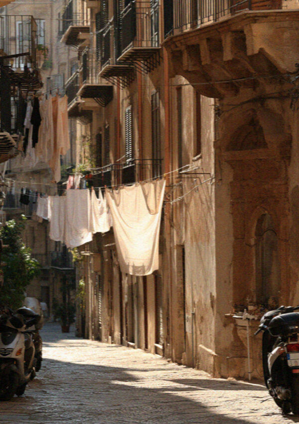 A narrow side street with laundry in Palermo, Sicily