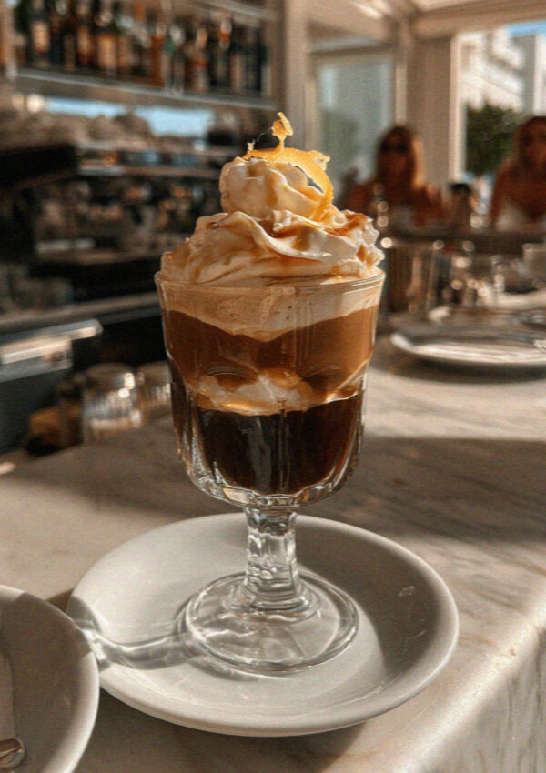Caffè speciale served warm in a glass, Polignano a Mare