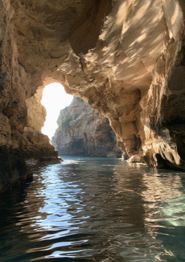 Light on the water inside a sea cave at Polignano a Mare
