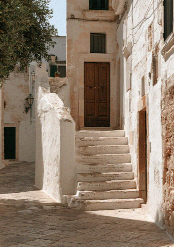A painted verse on a step in the old town of Polignano a Mare