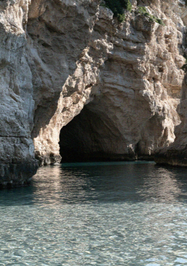 The mouth of a sea cave seen from the water at Polignano a Mare
