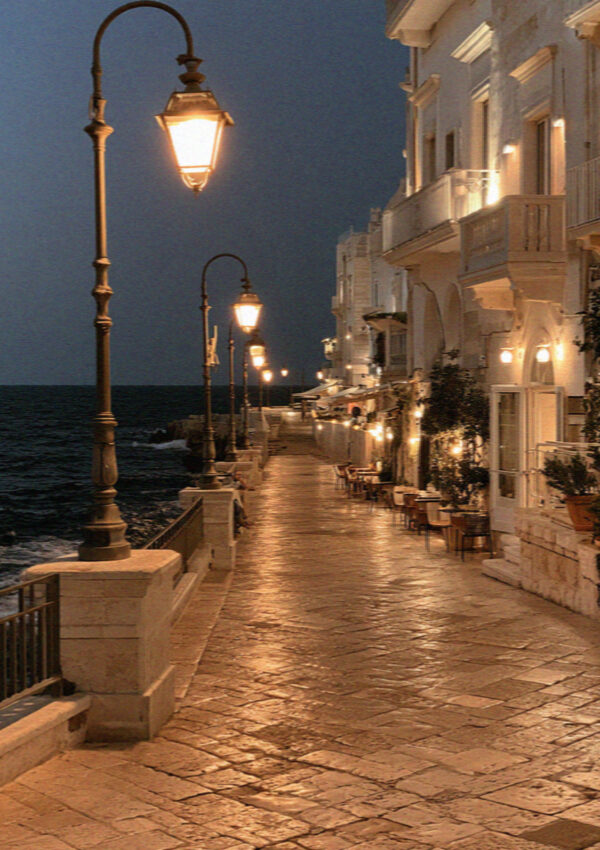 The seafront promenade at night in Polignano a Mare
