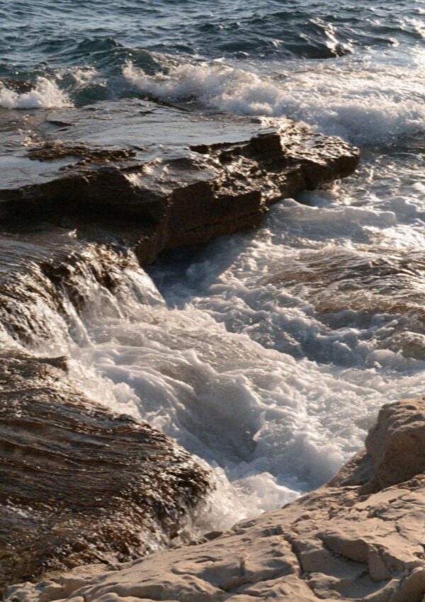 Spray coming over the low rocks at Polignano a Mare