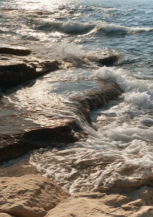 Swell breaking over the rock shelf at Polignano a Mare