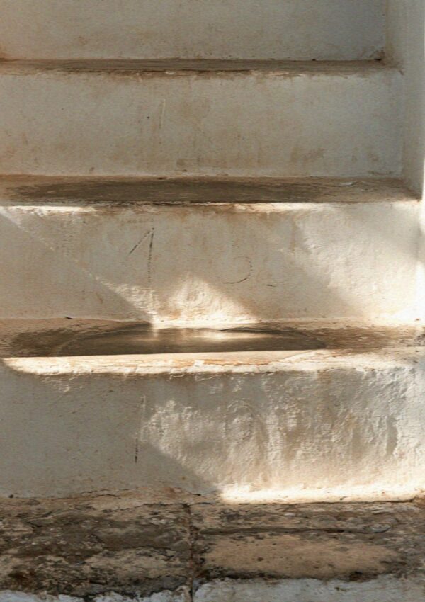 Worn whitewashed stone steps in the old town of Polignano a Mare