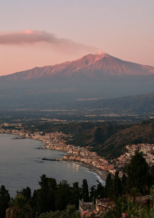 The volcano seen along the coast from Taormina at dusk