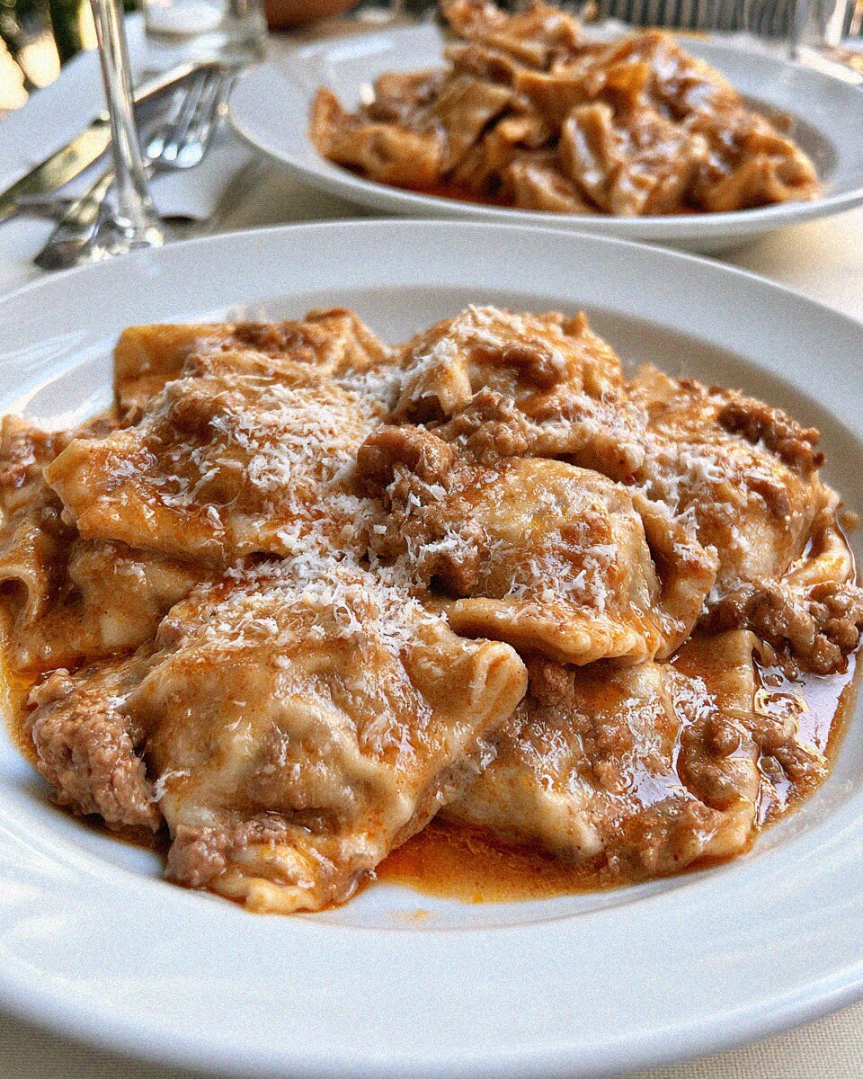 Tordelli lucchesi, meat-filled pasta in ragu dusted with parmesan