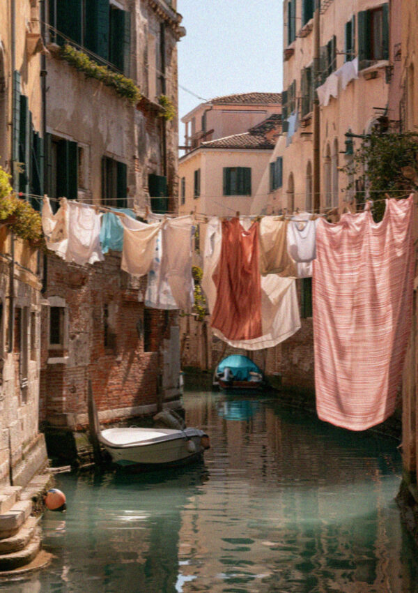 Laundry strung across a quiet Venetian back canal