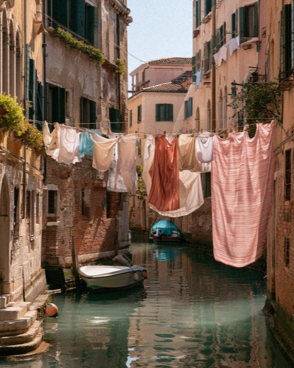 Laundry strung across a quiet Venetian back canal