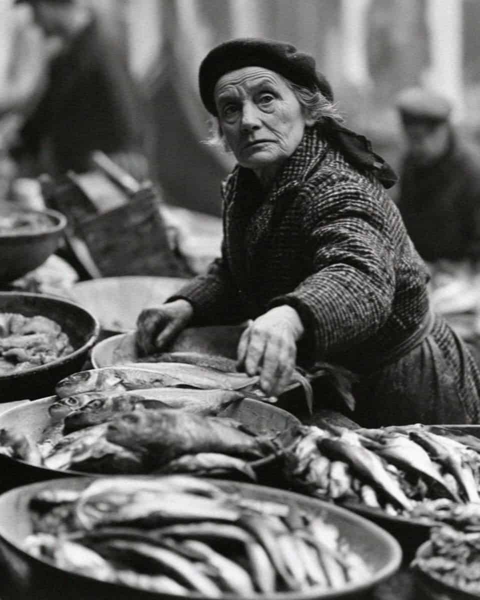 A woman choosing fish at the Rialto market, Venice
