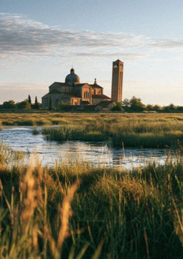 The cathedral and leaning campanile of Torcello across the lagoon