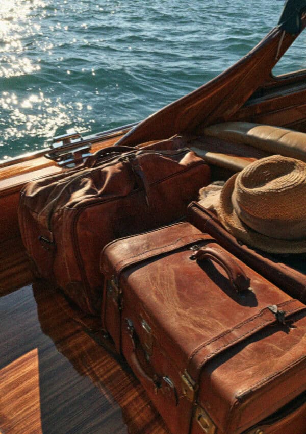 Luggage on the deck of a wooden Venetian water taxi