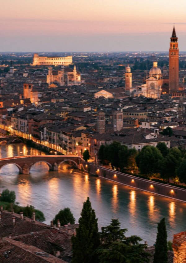 Verona's rooftops and the Adige river at dusk from Castel San Pietro