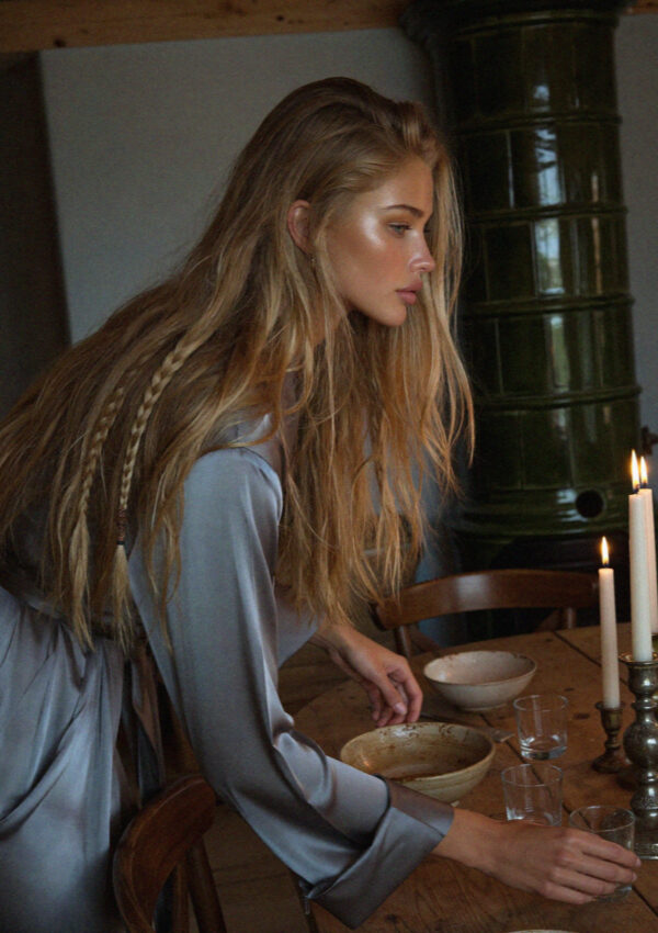 Victoria van der Berg at a candlelit table in a South Tyrolean maso in the Dolomites