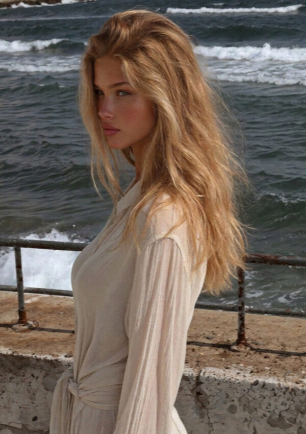 Victoria van der Berg at the railing above the sea on Ischia