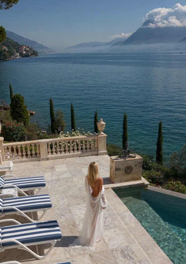 A grand hotel pool terrace above Lake Garda