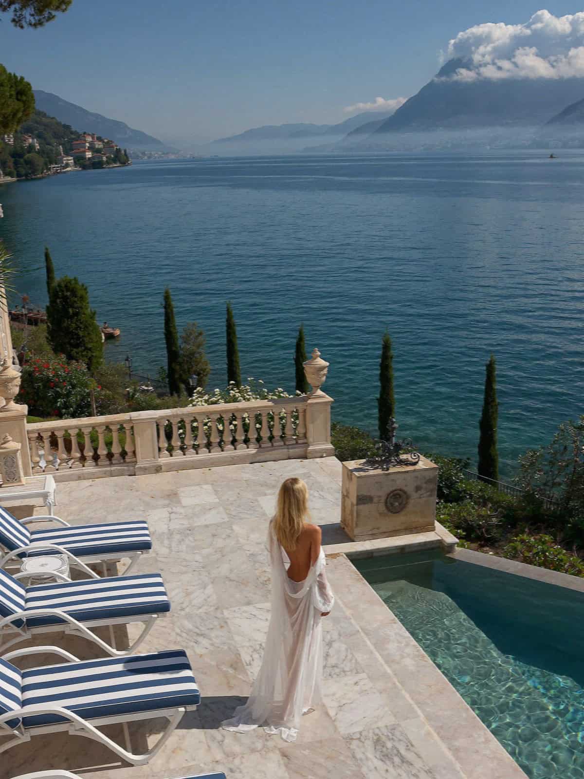 A grand hotel pool terrace above Lake Garda