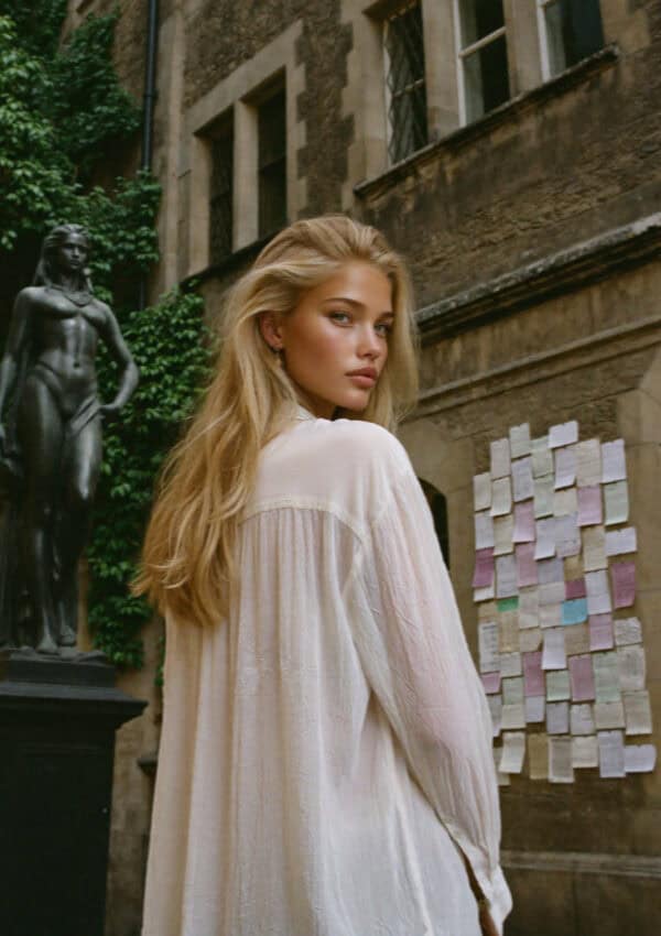 Victoria beside the wall of love notes at Juliet's House, Verona