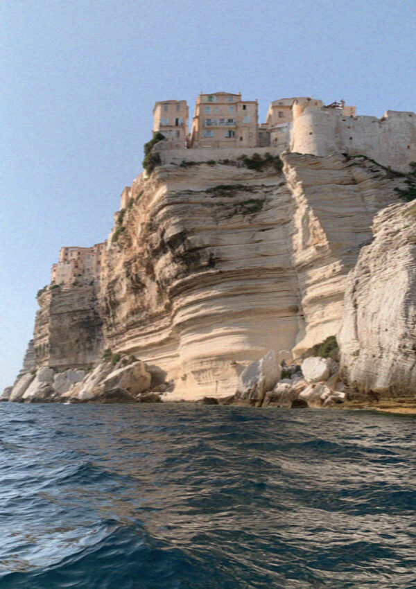 The white cliffs and clifftop houses of Bonifacio in Corsica seen from the sea