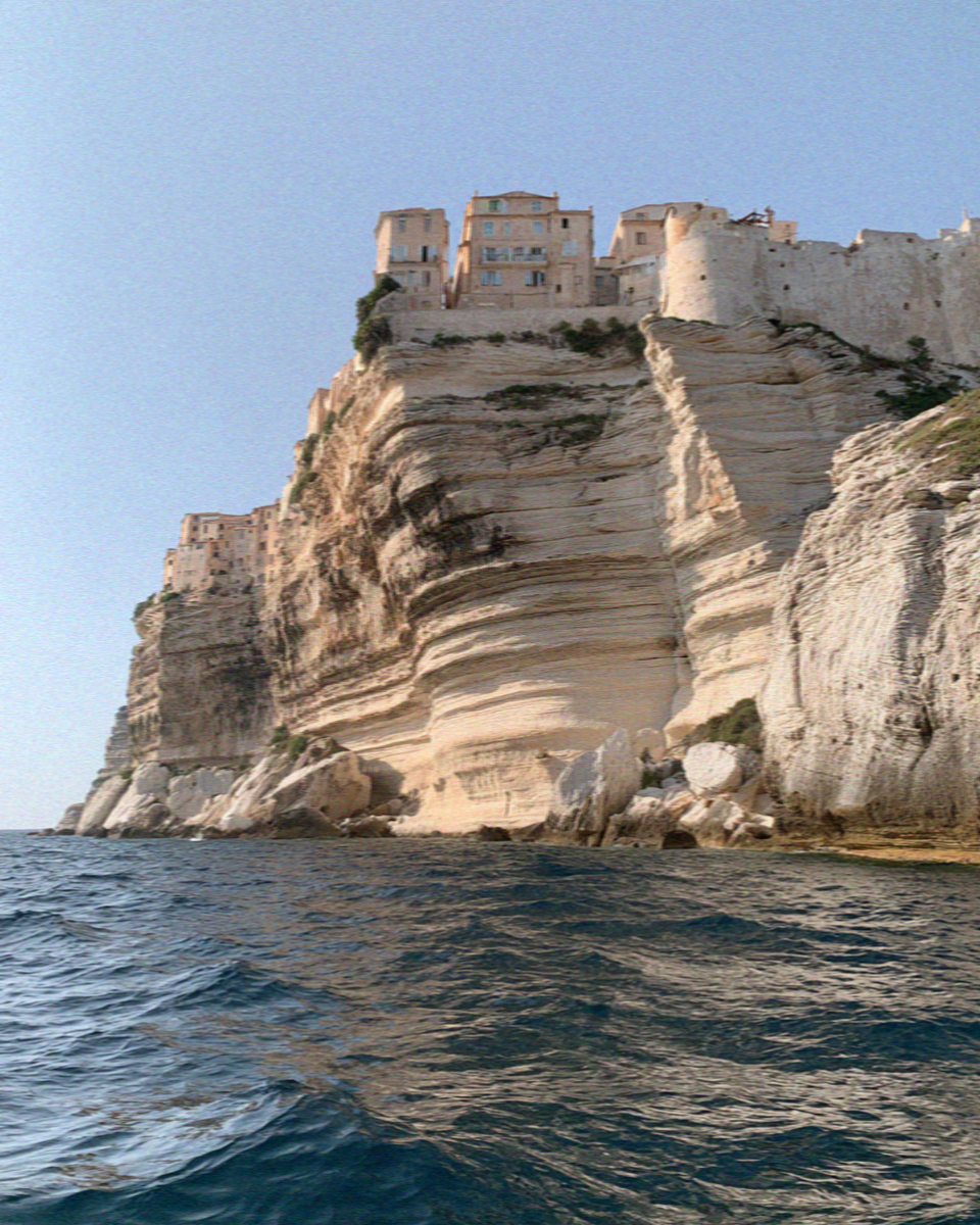 The white cliffs and clifftop houses of Bonifacio in Corsica seen from the sea