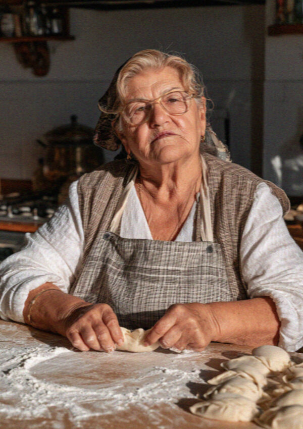 A woman pleating culurgiones by hand in Cagliari, Sardinia