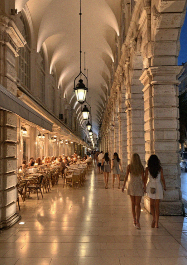 Lamplight under the arcade at night in Corfu Town in the Ionian islands