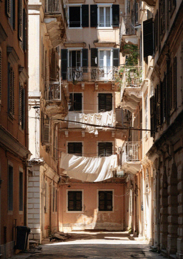 An open first floor shutter above a lane in Corfu Town in the Ionian islands