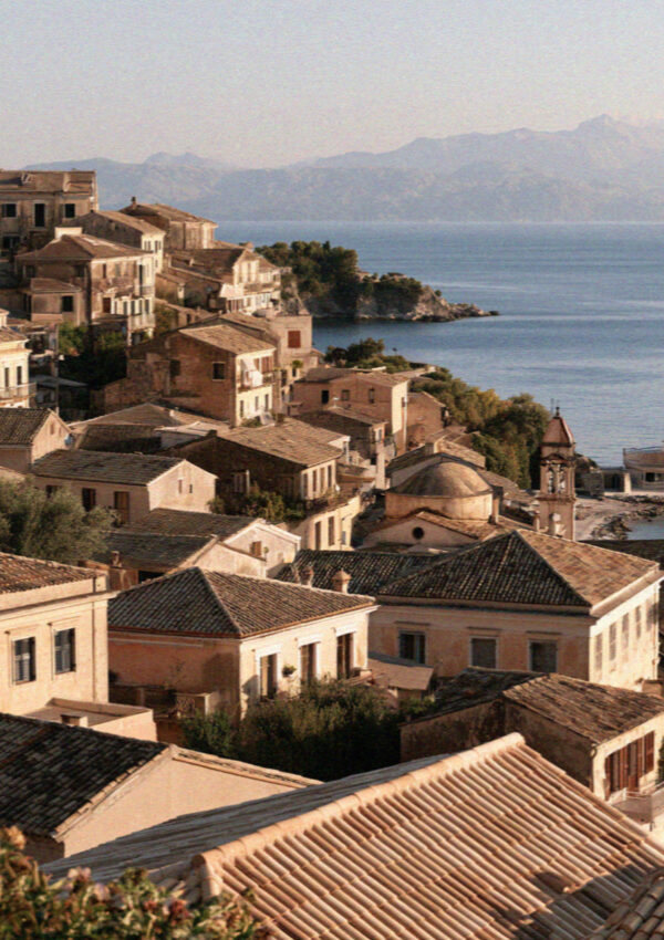 The terracotta rooftops of Corfu Town running down to the sea in the Ionian islands