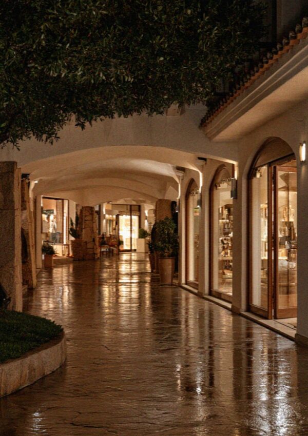 The shopfronts shut and still lit late at night on the Costa Smeralda in Sardinia