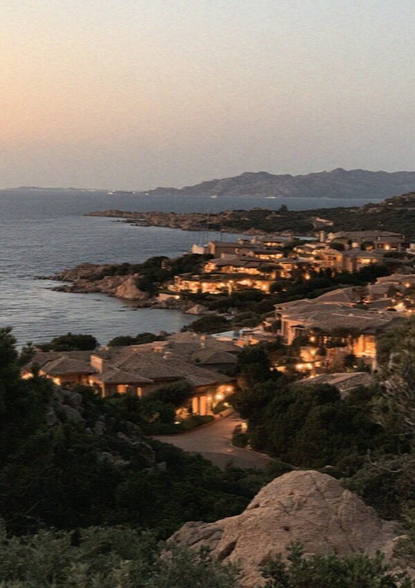 The Costa Smeralda coast lit up at dusk in Sardinia