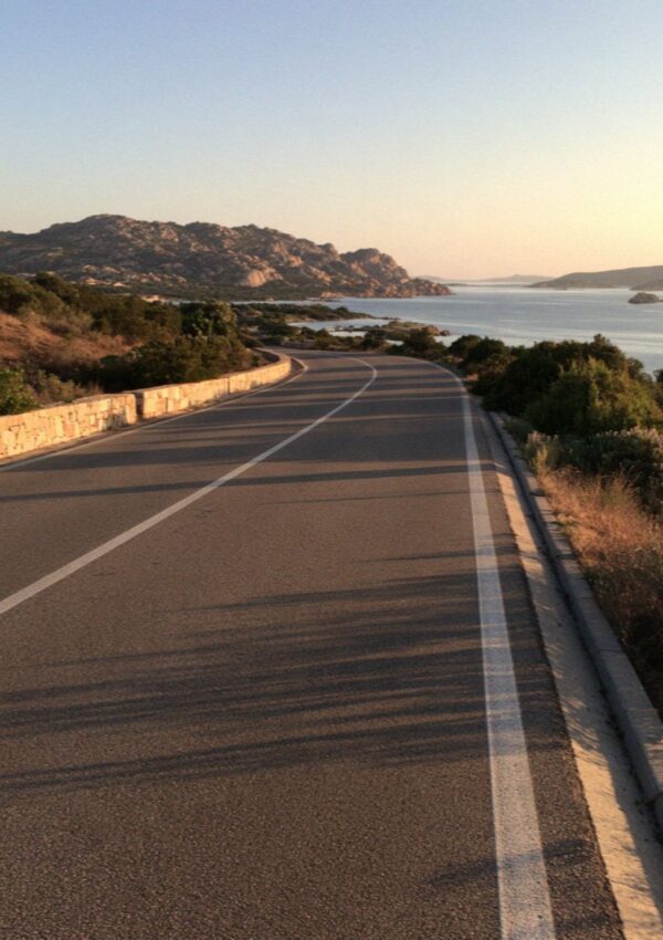 The empty road between the bays in the evening on the Costa Smeralda in Sardinia