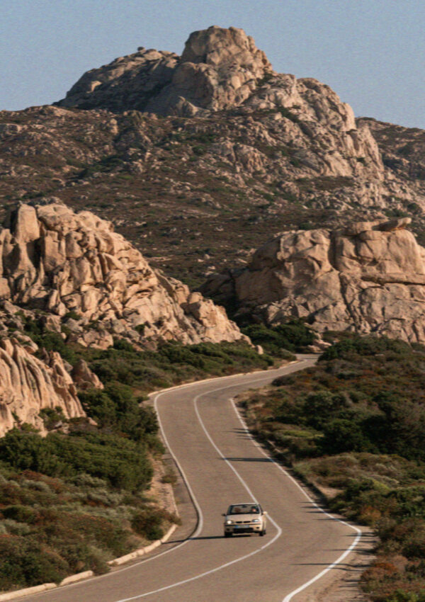 A hire car on the granite road to the Costa Smeralda in Sardinia