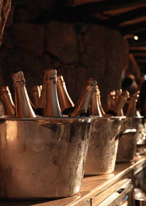 Champagne in silver ice buckets lined up on the bar on the Costa Smeralda in Sardinia